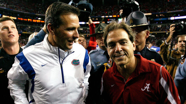 ATLANTA - DECEMBER 06: Head coach Nick Saban of the Alabama Crimson Tide congratulates head coach Urban Meyer of the Florida Gators after the Gators 31-20 win in the SEC Championship on December 6, 2008 at the Georgia Dome in Atlanta, Georgia.