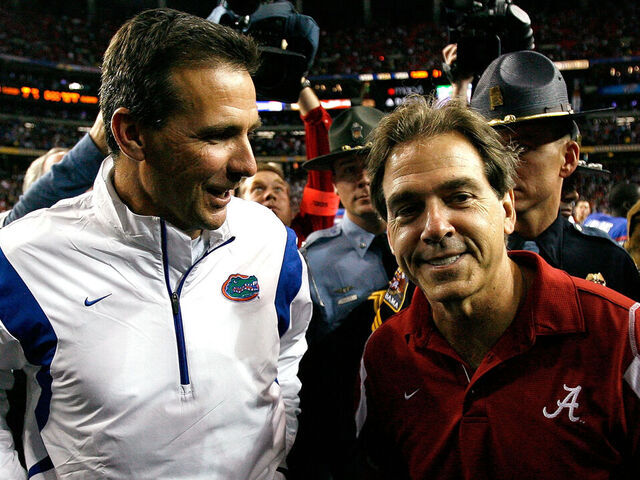 ATLANTA - DECEMBER 06: Head coach Nick Saban of the Alabama Crimson Tide congratulates head coach Urban Meyer of the Florida Gators after the Gators 31-20 win in the SEC Championship on December 6, 2008 at the Georgia Dome in Atlanta, Georgia.