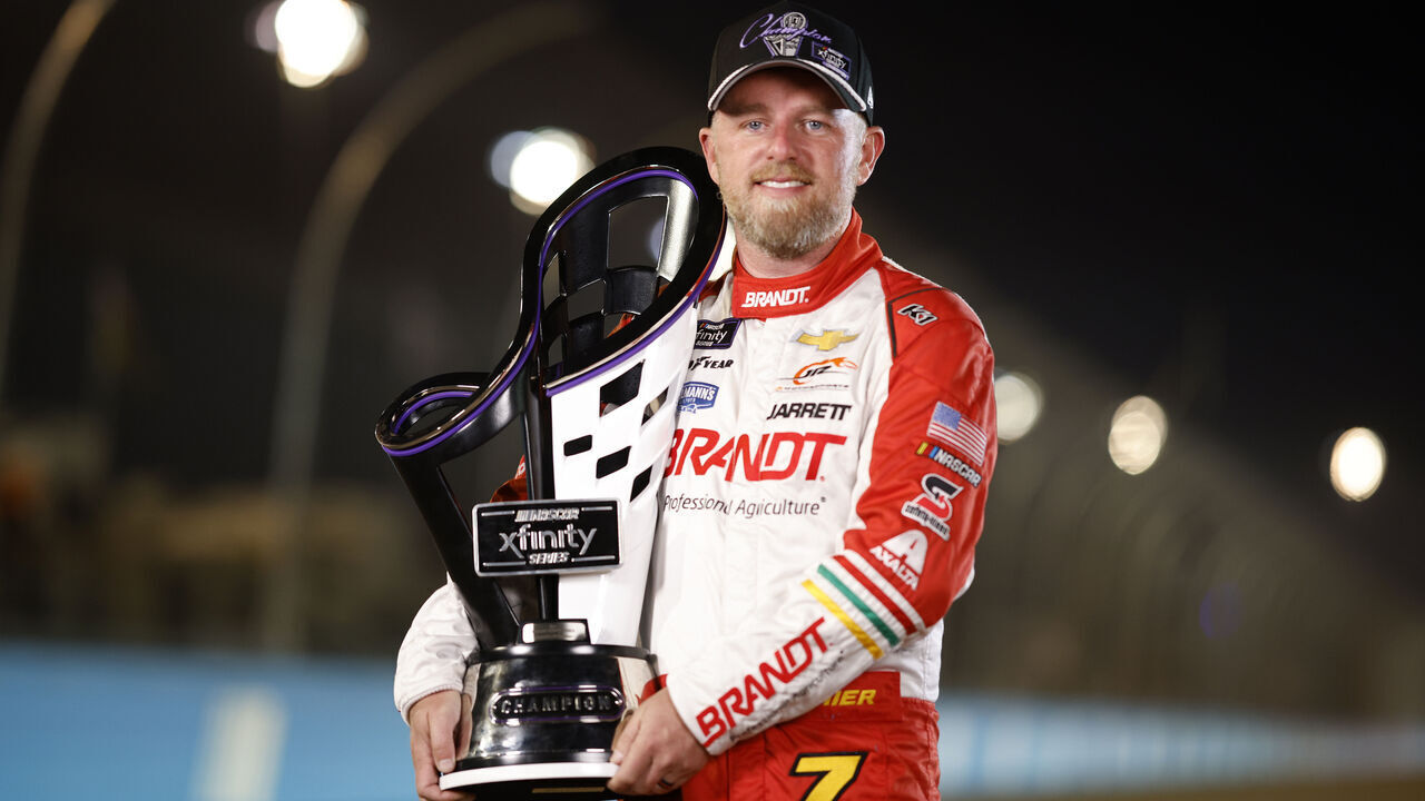 AVONDALE, ARIZONA - NOVEMBER 09: Justin Allgaier, driver of the #7 BRANDT Chevrolet, poses for a photo after winning the 2024 NASCAR Xfinity Series Championship in the NASCAR Xfinity Series Championship Race a at Phoenix Raceway on November 09, 2024 in Avondale, Arizona.