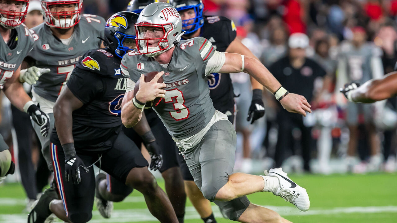 KANSAS CITY, KS - SEPTEMBER 13:UNLV quarterback Matthew Sluka (3) scrambles with the ball during the game between the Kansas Jayhawks and the UNLV Rebels on Friday September 13, 2024 at Children's Mercy Park in Kansas City, Kansas.