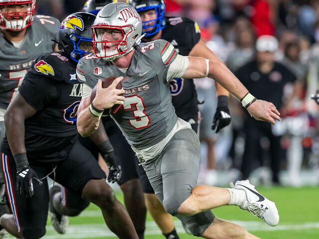 KANSAS CITY, KS - SEPTEMBER 13:UNLV quarterback Matthew Sluka (3) scrambles with the ball during the game between the Kansas Jayhawks and the UNLV Rebels on Friday September 13, 2024 at Children's Mercy Park in Kansas City, Kansas.