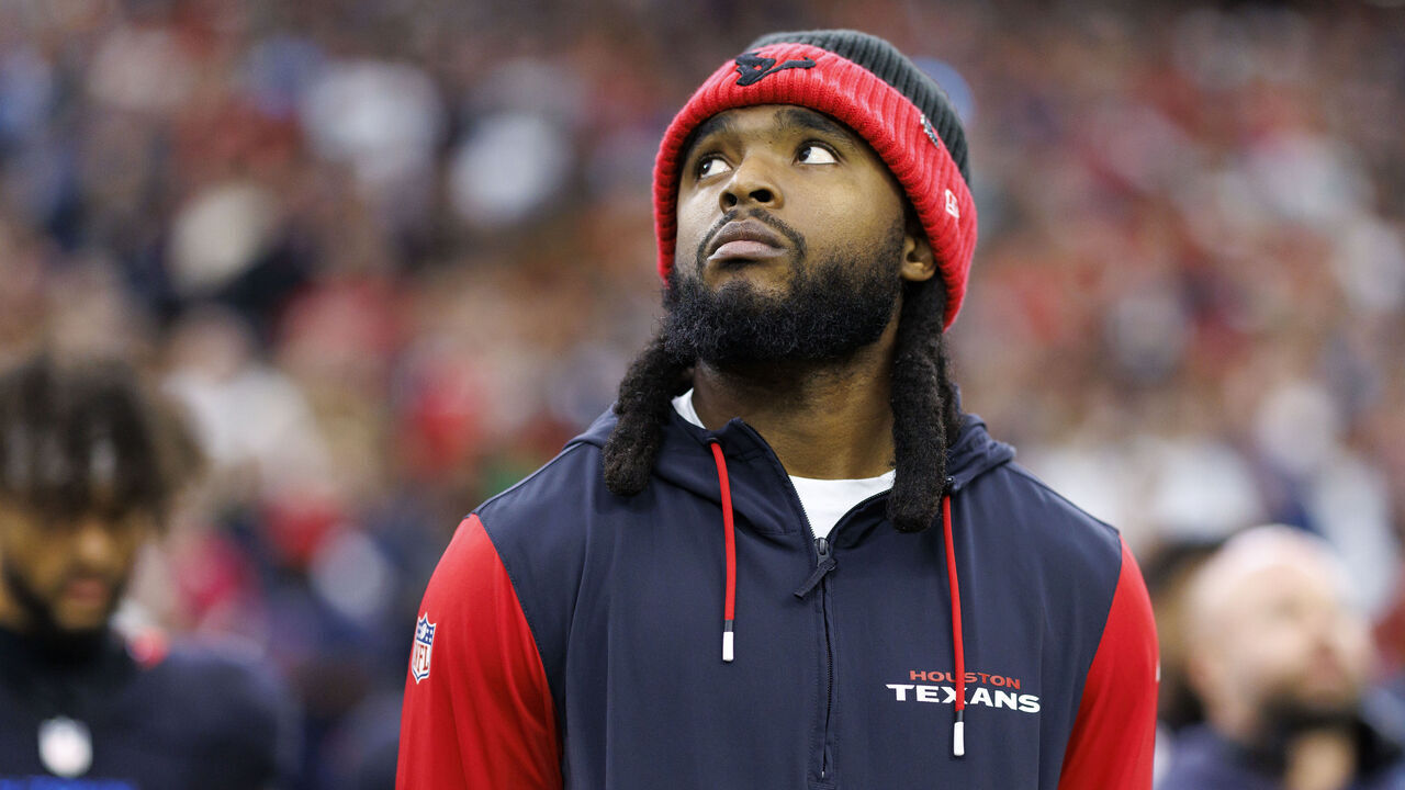 HOUSTON, TEXAS - DECEMBER 25: Wide receiver Diontae Johnson #18 of the Houston Texans stands on the sidelines during the national anthem prior to an NFL football game against the Baltimore Ravens, at NRG Stadium on December 25, 2024 in Houston, Texas.