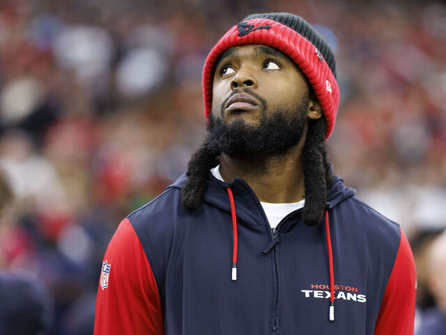 HOUSTON, TEXAS - DECEMBER 25: Wide receiver Diontae Johnson #18 of the Houston Texans stands on the sidelines during the national anthem prior to an NFL football game against the Baltimore Ravens, at NRG Stadium on December 25, 2024 in Houston, Texas.