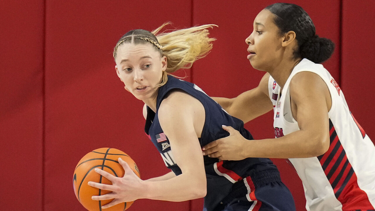 NEW YORK, NY - JANUARY 15: Paige Bueckers #5 of the UConn Huskies dribbles the ball against Jade Blagrove #20 of the St. John's Red Storm in the first half at Carnesecca Arena on January 15, 2025 in the Queens borough of New York City. .