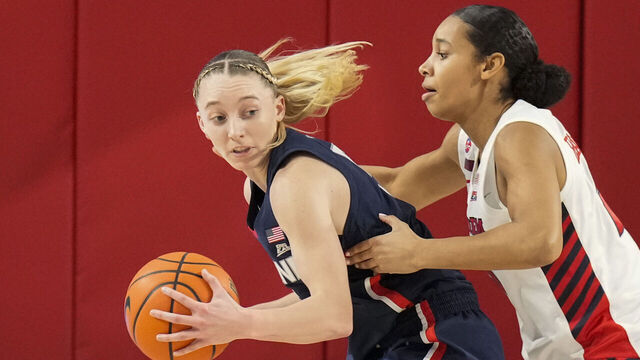 NEW YORK, NY - JANUARY 15: Paige Bueckers #5 of the UConn Huskies dribbles the ball against Jade Blagrove #20 of the St. John's Red Storm in the first half at Carnesecca Arena on January 15, 2025 in the Queens borough of New York City. .