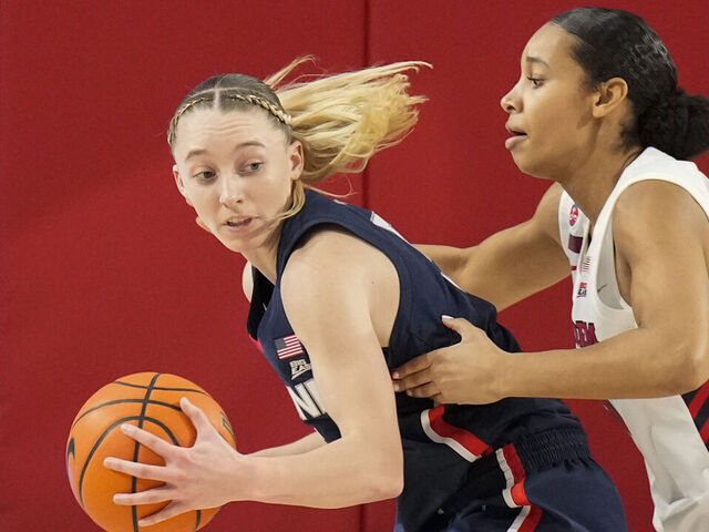 NEW YORK, NY - JANUARY 15: Paige Bueckers #5 of the UConn Huskies dribbles the ball against Jade Blagrove #20 of the St. John's Red Storm in the first half at Carnesecca Arena on January 15, 2025 in the Queens borough of New York City. .