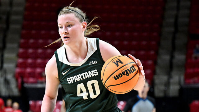 COLLEGE PARK, MARYLAND - DECEMBER 29: Julia Ayrault #40 of the Michigan State Spartans handles the ball against the Maryland Terrapins at Xfinity Center on December 29, 2024 in College Park, Maryland.
