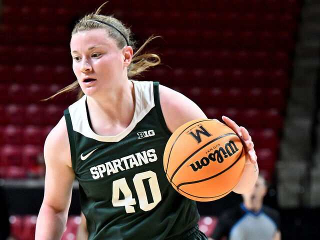 COLLEGE PARK, MARYLAND - DECEMBER 29: Julia Ayrault #40 of the Michigan State Spartans handles the ball against the Maryland Terrapins at Xfinity Center on December 29, 2024 in College Park, Maryland.