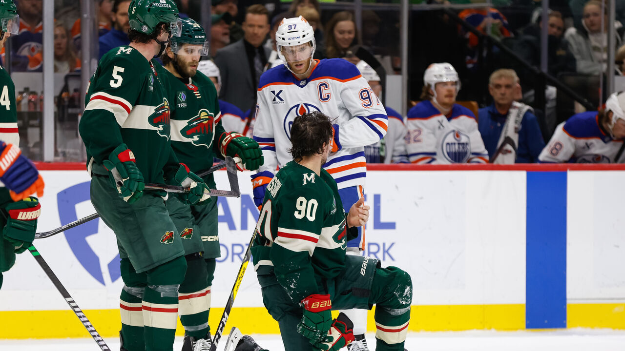 ST. PAUL, MN - JANUARY 15: Minnesota Wild center Marcus Johansson (90) talks with Edmonton Oilers center Connor McDavid (97) after being injured during the NHL game between the Minnesota Wild and Edmonton Oilers on January 15th, 2025, at the Xcel Energy Center in St. Paul, MN.