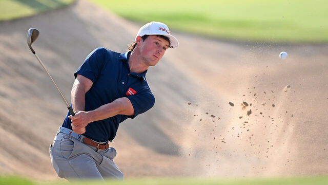 DUBAI, UNITED ARAB EMIRATES - JANUARY 16: David Ford of the United States plays his third shot on the sixth hole from a greenside bunker on day one of the Hero Dubai Desert Classic at Emirates Golf Club on January 16, 2025 in Dubai, United Arab Emirates.