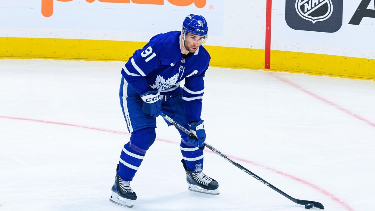 TORONTO, ON - JANUARY 14: Toronto Maple Leafs Center John Tavares (91) skates with the puck during the NHL regular season game between the Dallas Stars and the Toronto Maple Leafs on January 14, 2025, at Scotiabank Arena in Toronto, ON, Canada.