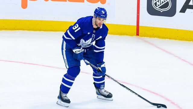 TORONTO, ON - JANUARY 14: Toronto Maple Leafs Center John Tavares (91) skates with the puck during the NHL regular season game between the Dallas Stars and the Toronto Maple Leafs on January 14, 2025, at Scotiabank Arena in Toronto, ON, Canada.