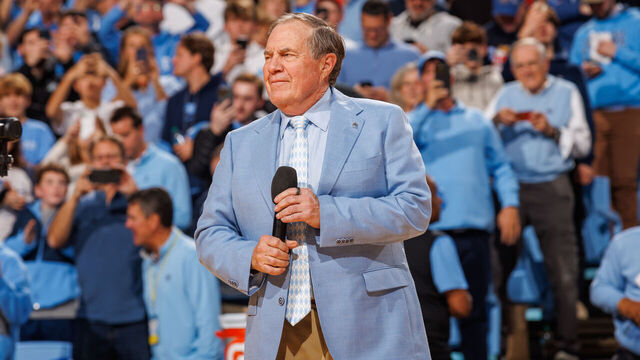CHAPEL HILL, NORTH CAROLINA - DECEMBER 14: North Carolina Tar Heels football head coach Bill Belichick speaks to the crowd during a basketball game against the La Salle Explorers at Dean E. Smith Center on December 14, 2024 in Chapel Hill, North Carolina. North Carolina won 93-67.