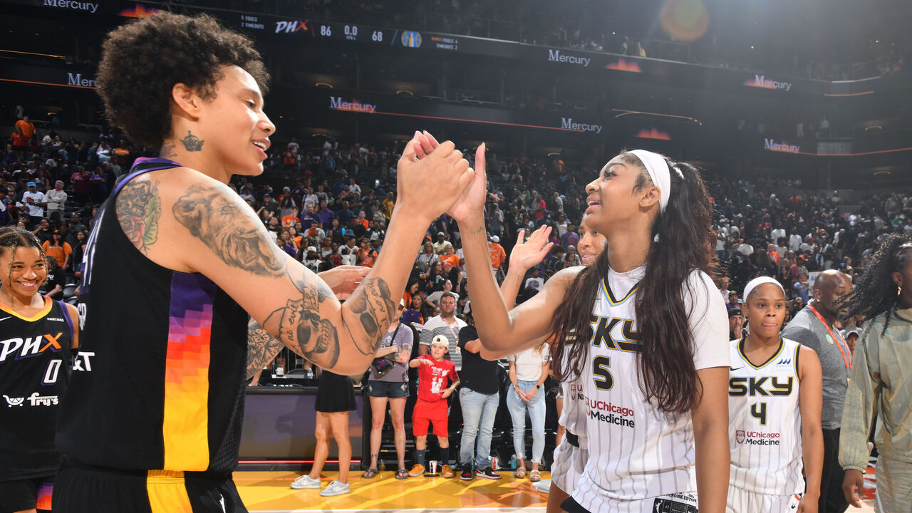 PHOENIX, AZ - AUGUST 18: Brittney Griner #42 of the Phoenix Mercury and Angel Reese #5 of the Chicago Sky embrace after the game on August 18, 2024 at Footprint Center in Phoenix, Arizona. Mandatory Copyright Notice: Copyright 2024 NBAE