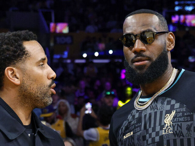 LOS ANGELES, CALIFORNIA - MARCH 8: LeBron James #23 of the Los Angeles Lakers wearing a Liverpool FC jersey and Maverick Carter attends the game between Los Angeles Lakers and Milwaukee Bucks at Crypto.com Arena on March 8, 2024 in Los Angeles, California.