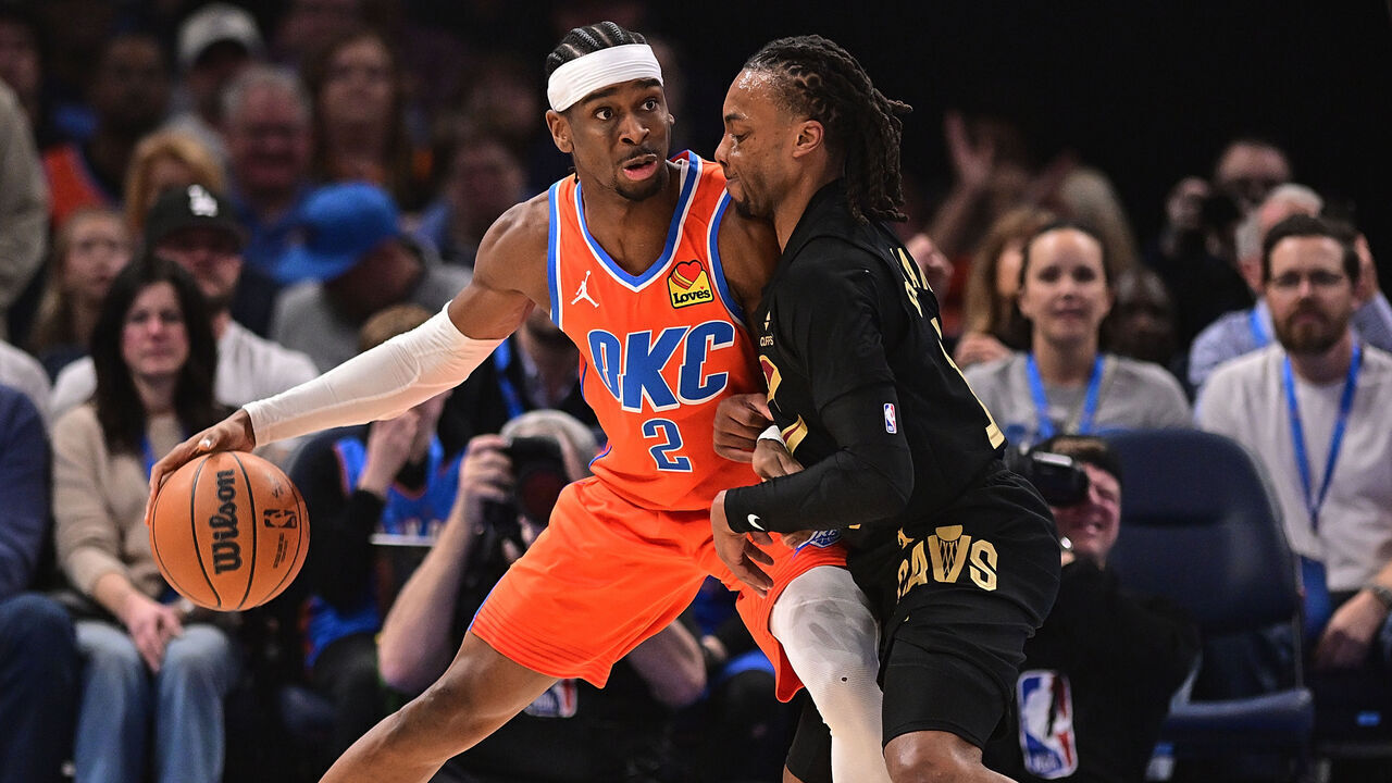 OKLAHOMA CITY, OKLAHOMA - JANUARY 16: Shai Gilgeous-Alexander #2 of the Oklahoma City Thunder handles the ball in front of Darius Garland #10 of the Cleveland Cavaliers during the first half at Paycom Center on January 16, 2025 in Oklahoma City, Oklahoma.