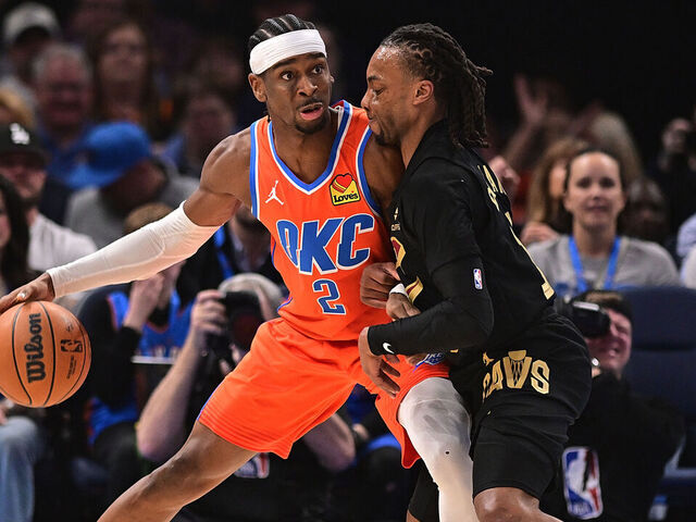 OKLAHOMA CITY, OKLAHOMA - JANUARY 16: Shai Gilgeous-Alexander #2 of the Oklahoma City Thunder handles the ball in front of Darius Garland #10 of the Cleveland Cavaliers during the first half at Paycom Center on January 16, 2025 in Oklahoma City, Oklahoma.