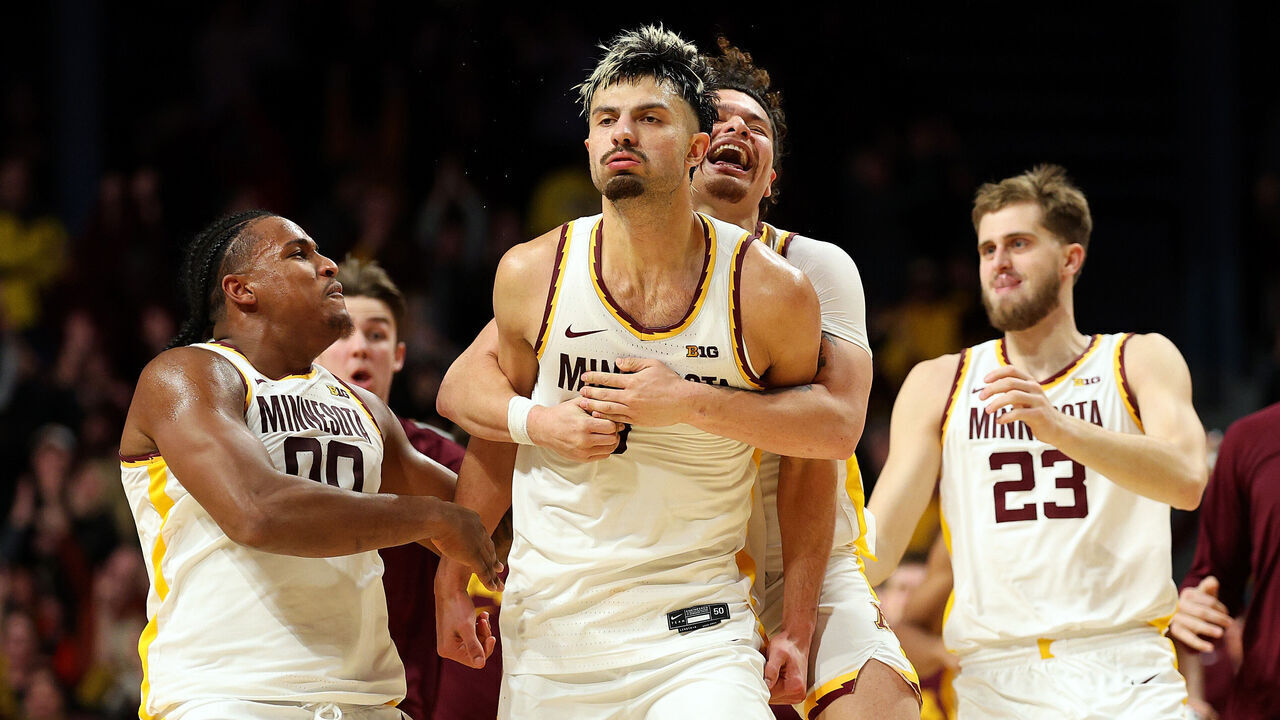 MINNEAPOLIS, MINNESOTA - JANUARY 16: Dawson Garcia #3 of the Minnesota Golden Gophers (C) celebrates his game-winning basket against the Michigan Wolverines after the game at Williams Arena on January 16, 2025 in Minneapolis, Minnesota. The Golden Gophers defeated the Wolverines 84-81.