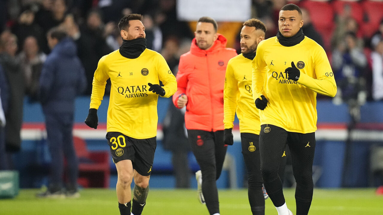 PARIS, FRANCE - JANUARY 29: Leo Messi (left), Neymar Jr (middle) and Kylian Mbappe (right) enter the field for the warm up prior to the French Ligue 1 match between Paris Saint-Germain (PSG) and Stade de Reims at Parc des Princes on January 29, 2023 in Paris, France.