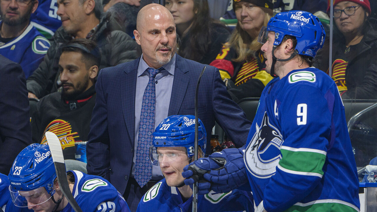 VANCOUVER, CANADA - JANUARY 16: Head coach Rick Tocchet of the Vancouver Canucks talks with J.T. Miller #9 of the Vancouver Canucks during the second period of their NHL game against the Los Angeles Kings at Rogers Arena on January 16, 2025 in Vancouver, British Columbia, Canada.
