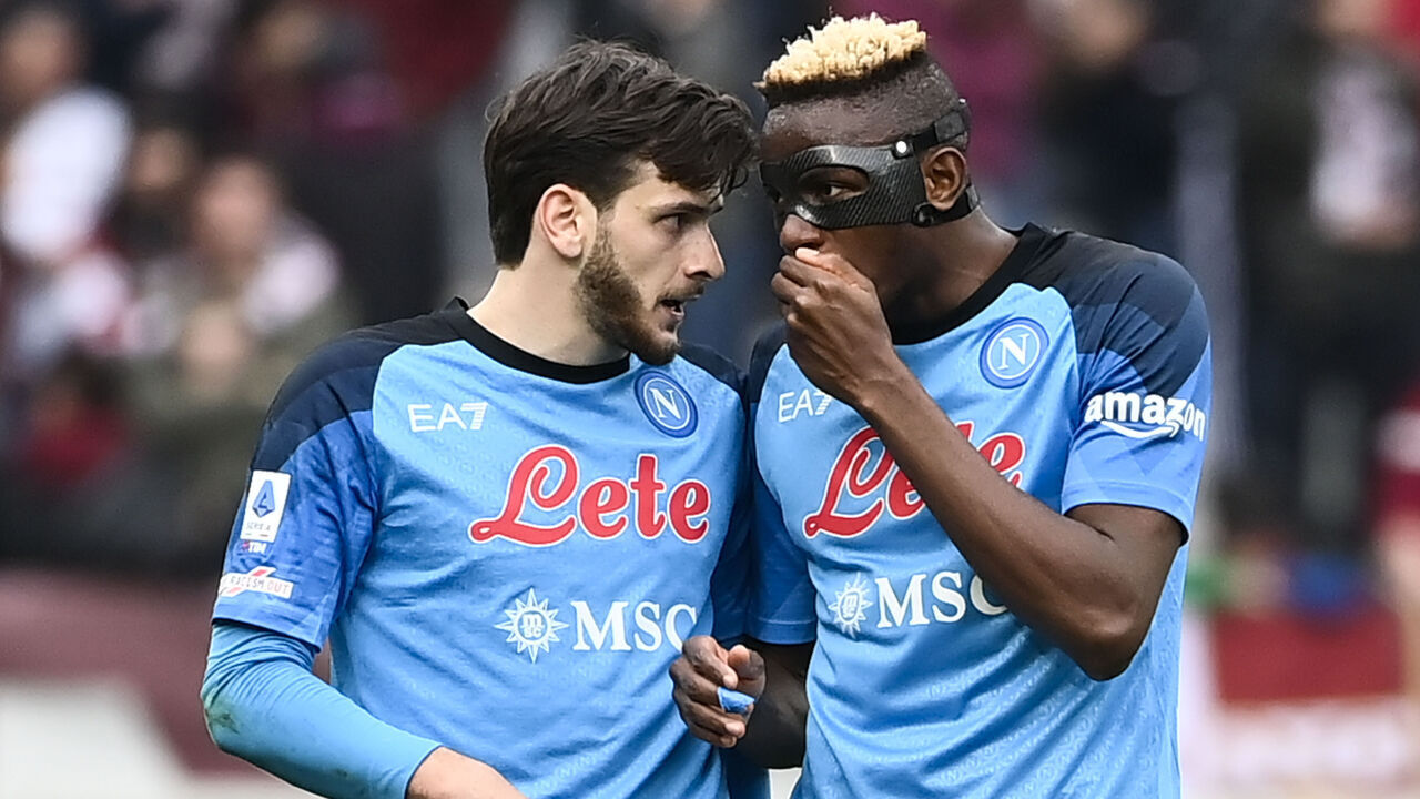 TURIN, ITALY - MARCH 19: (L-R) Khvicha Kvaratskhelia of SSC Napoli and Victor Osimhen of SSC Napoli speaks during the Serie A match between Torino FC and SSC Napoli at Stadio Olimpico di Torino on March 19, 2023 in Turin, Italy.