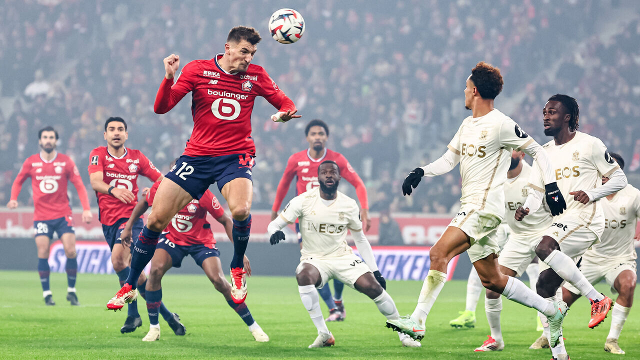 Lille's Belgian defender #12 Thomas Meunier heads the ball during the French L1 football match between Lille LOSC and OGC Nice at Stade Pierre-Mauroy in Villeneuve-d'Ascq, northern France on January 17, 2025.