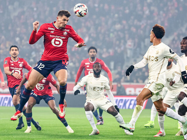 Lille's Belgian defender #12 Thomas Meunier heads the ball during the French L1 football match between Lille LOSC and OGC Nice at Stade Pierre-Mauroy in Villeneuve-d'Ascq, northern France on January 17, 2025.