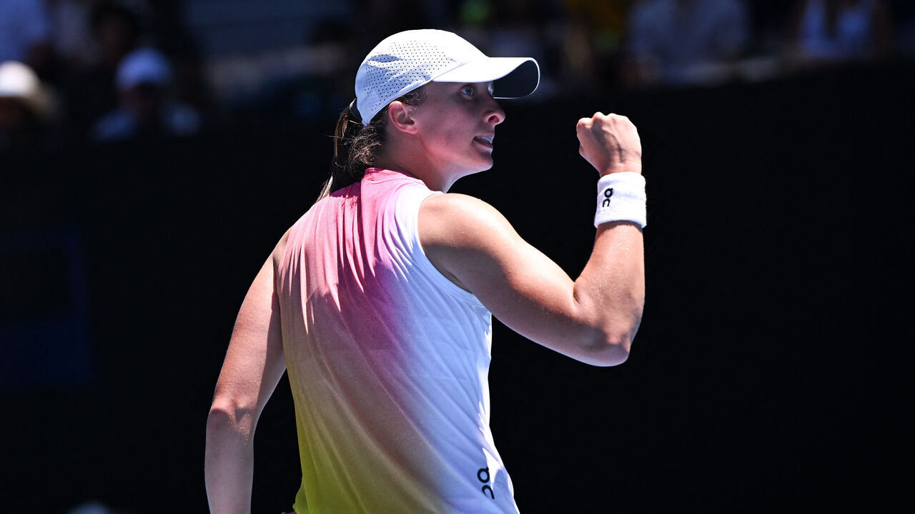 Poland's Iga Swiatek celebrates the match point against Britain's Emma Raducanu during their women's singles match on day seven of the Australian Open tennis tournament in Melbourne on January 18, 2025.