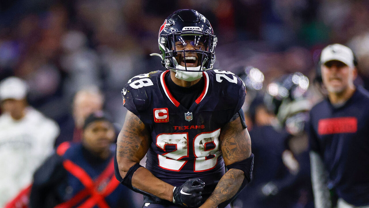 HOUSTON, TEXAS - JANUARY 11: Joe Mixon #28 of the Houston Texans celebrates in the second half during the AFC Wild Card Playoff game against the Los Angeles Chargers at NRG Stadium on January 11, 2025 in Houston, Texas.