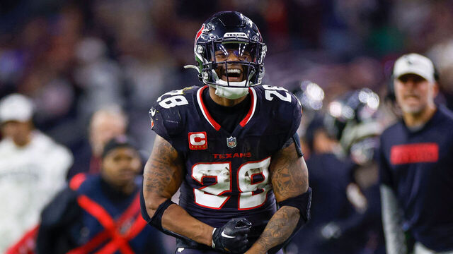 HOUSTON, TEXAS - JANUARY 11: Joe Mixon #28 of the Houston Texans celebrates in the second half during the AFC Wild Card Playoff game against the Los Angeles Chargers at NRG Stadium on January 11, 2025 in Houston, Texas.
