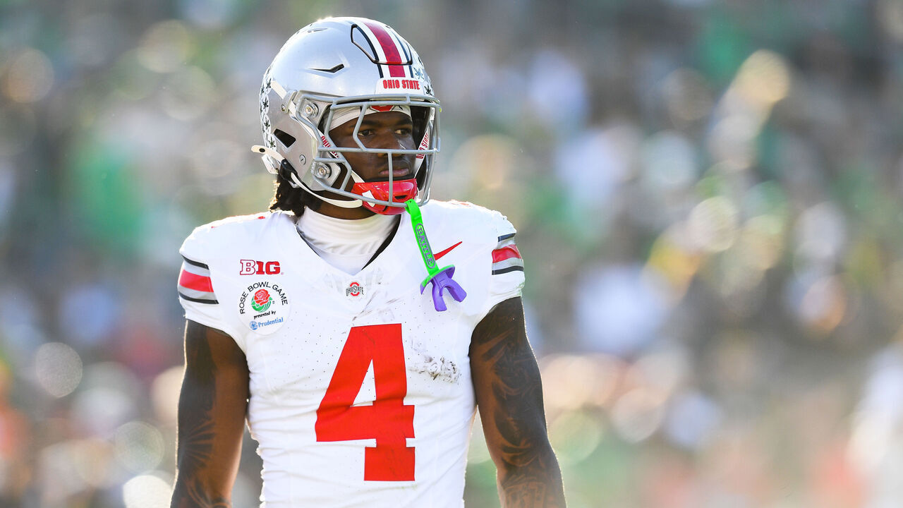PASADENA, CA - JANUARY 01: Wide Receiver Jeremiah Smith #4 of the Ohio State Buckeyes looks on during the Ohio State Buckeyes versus Oregon Ducks in the College Football Playoff Quarterfinal at the Rose Bowl Game on January 1, 2025 at the Rose Bowl Stadium in Pasadena, CA.