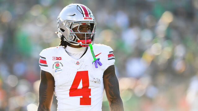 PASADENA, CA - JANUARY 01: Wide Receiver Jeremiah Smith #4 of the Ohio State Buckeyes looks on during the Ohio State Buckeyes versus Oregon Ducks in the College Football Playoff Quarterfinal at the Rose Bowl Game on January 1, 2025 at the Rose Bowl Stadium in Pasadena, CA.