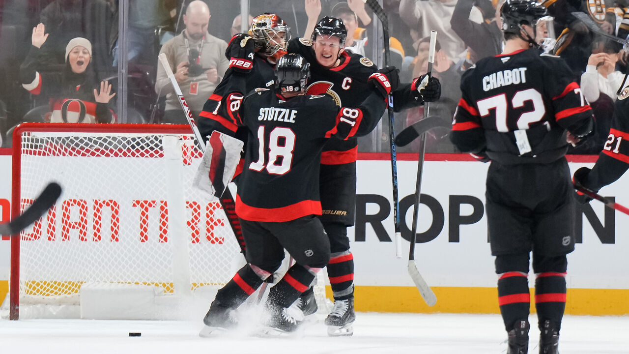 OTTAWA, CANADA - JANUARY 18: Leevi Merilainen #1, Tim Stützle #18, and Brady Tkachuk #7 of the Ottawa Senators celebrate a shootout win over the Boston Bruins at Canadian Tire Centre on January 18, 2025 in Ottawa, Ontario, Canada.