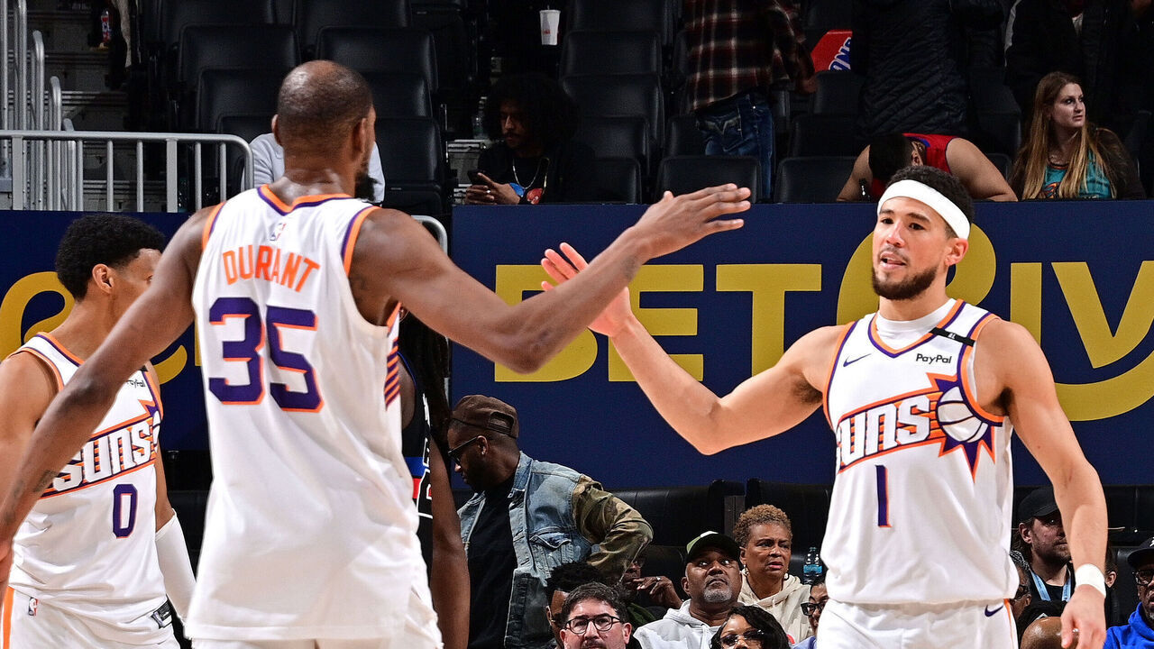 DETROIT, MI - JANUARY 18: Kevin Durant #35 and Devin Booker #1 of the Phoenix Suns high five during the game against the Detroit Pistons on January 18, 2025 at Little Caesars Arena in Detroit, Michigan. NOTE TO USER: User expressly acknowledges and agrees that, by downloading and/or using this photograph, User is consenting to the terms and conditions of the Getty Images License Agreement. Mandatory Copyright Notice: Copyright 2025 NBAE