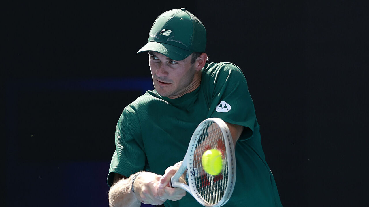 MELBOURNE, AUSTRALIA - JANUARY 19: Tommy Paul of the United States plays a backhand against Alejandro Davidovich Fokina of Spain in the Men's Singles Fourth Round match during day eight of the 2025 Australian Open at Melbourne Park on January 19, 2025 in Melbourne, Australia.