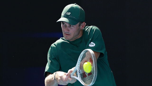MELBOURNE, AUSTRALIA - JANUARY 19: Tommy Paul of the United States plays a backhand against Alejandro Davidovich Fokina of Spain in the Men's Singles Fourth Round match during day eight of the 2025 Australian Open at Melbourne Park on January 19, 2025 in Melbourne, Australia.