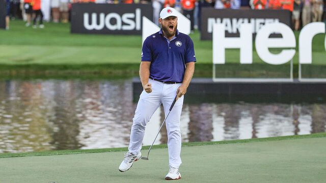 DUBAI, UNITED ARAB EMIRATES - JANUARY 19: Tyrrell Hatton of England celebrates holing the winning putt on the 18th green during the final round of the Hero Dubai Desert Classic at Emirates Golf Club on January 19, 2025 in Dubai, United Arab Emirates.