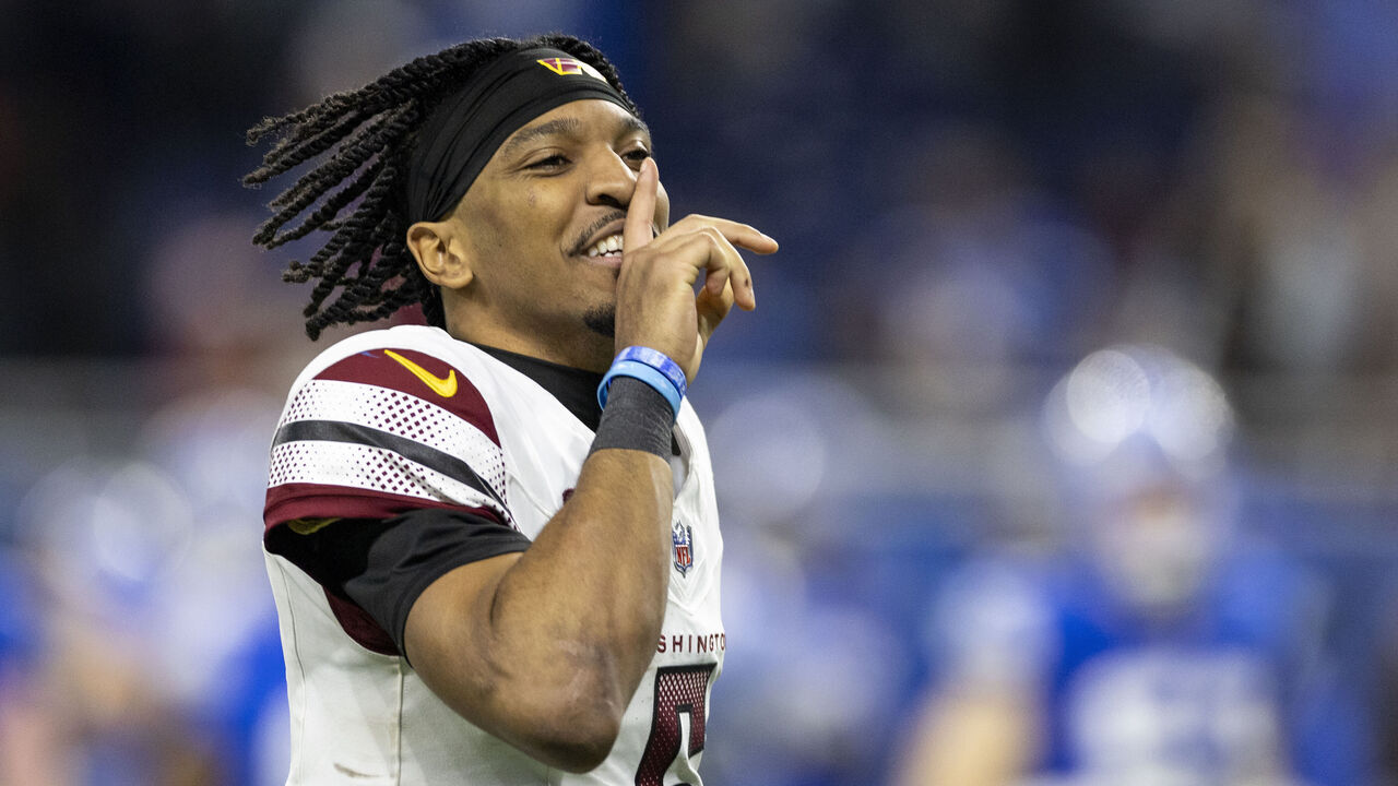 DETROIT, MICHIGAN - JANUARY 18: Jayden Daniels #5 of the Washington Commanders celebrates during an NFL Football game against the Detroit Lions at Ford Field on January 18, 2025 in Detroit, Michigan.