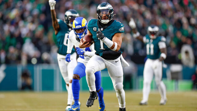 PHILADELPHIA, PENNSYLVANIA - JANUARY 19: Jalen Hurts #1 of the Philadelphia Eagles runs with the ball for a touchdown in the first quarter during the NFC Divisional Playoff game against the Los Angeles Rams at Lincoln Financial Field on January 19, 2025 in Philadelphia, Pennsylvania.
