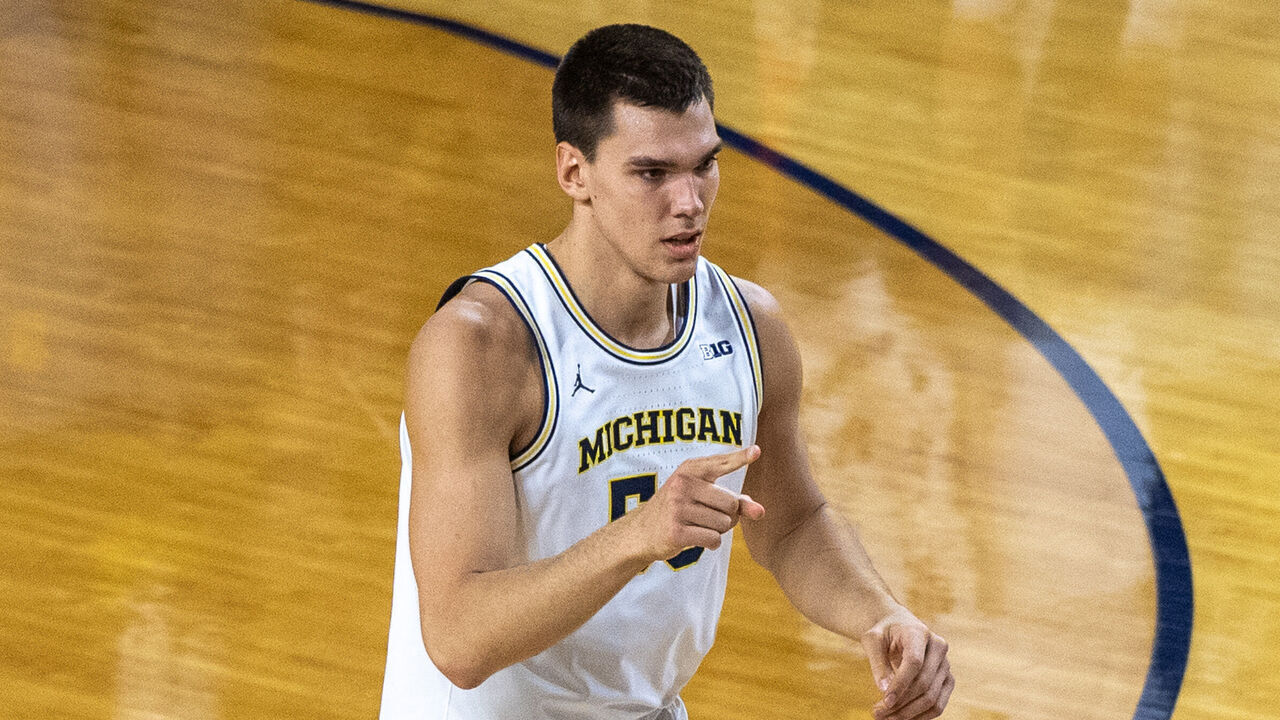 ANN ARBOR, MICHIGAN - JANUARY 19: Vladislav Goldin #50 of the Michigan Wolverines reacts after making a three point basket during the first half of a college basketball game against the Northwestern Wildcats at Crisler Arena on January 19, 2025 in Ann Arbor, Michigan.