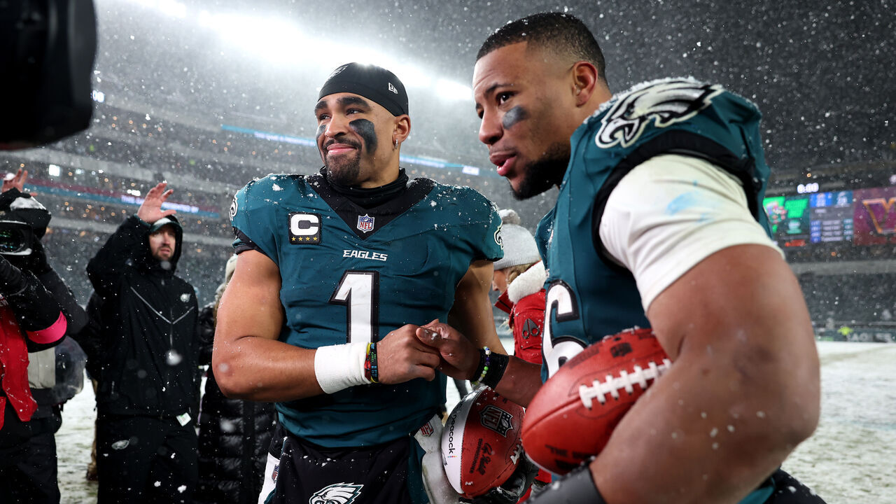 PHILADELPHIA, PENNSYLVANIA - JANUARY 19: (L-R) Jalen Hurts #1 and Saquon Barkley #26 of the Philadelphia Eagles react after defeating the Los Angeles Rams 28-22 in the NFC Divisional Playoff at Lincoln Financial Field on January 19, 2025 in Philadelphia, Pennsylvania.