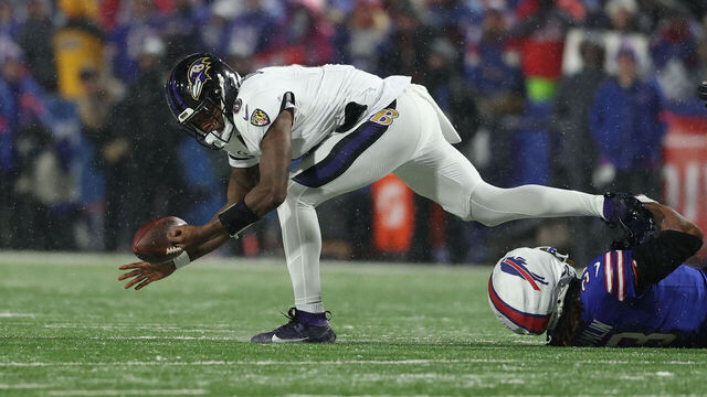 ORCHARD PARK, NEW YORK - JANUARY 19: Lamar Jackson #8 of the Baltimore Ravens fumbles the ball against the Buffalo Bills during the second quarter during the AFC Divisional Playoff at Highmark Stadium on January 19, 2025 in Orchard Park, New York.