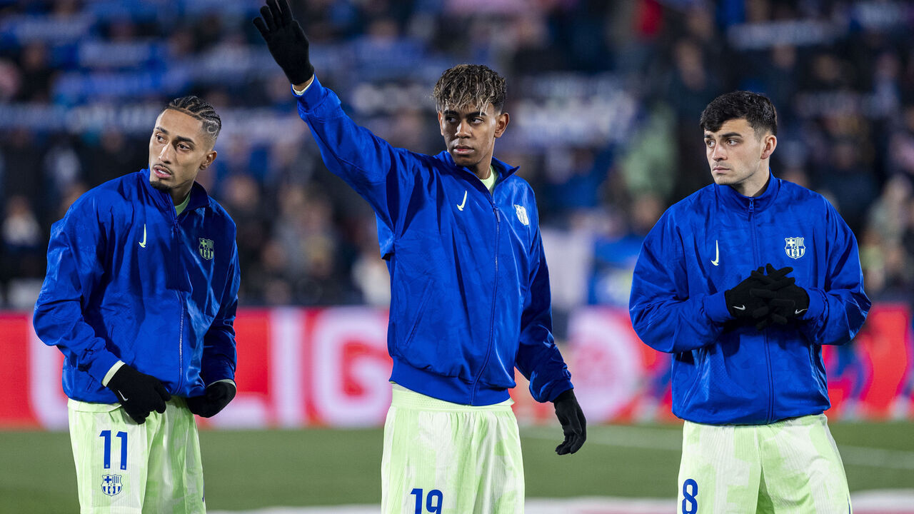 FC Barcelona players (from L to R) Raphael Dias Belloli (Raphinha), Lamine Yamal, and Pedro Gonzalez Lopez (Pedri) are seen during the performance of the official anthem before the La Liga EA Sports 2024/25 football match between Getafe CF and FC Barcelona at Estadio Coliseum in Getafe, Spain, on January 18, 2024.