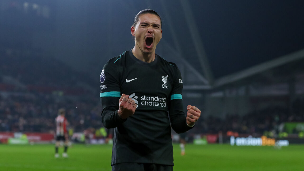Darwin Nunez celebrates in front of Liverpool's traveling fans during the Premier League match between Brentford and Liverpool at the Gtech Community Stadium in Brentford, England, on January 18, 2025.