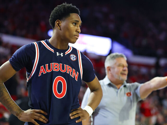 ATHENS, GEORGIA - JANUARY 18: Tahaad Pettiford #0 of the Auburn Tigers looks on as head coach Bruce Pearl reacts during the second half against the Georgia Bulldogs at Stegeman Coliseum on January 18, 2025 in Athens, Georgia.