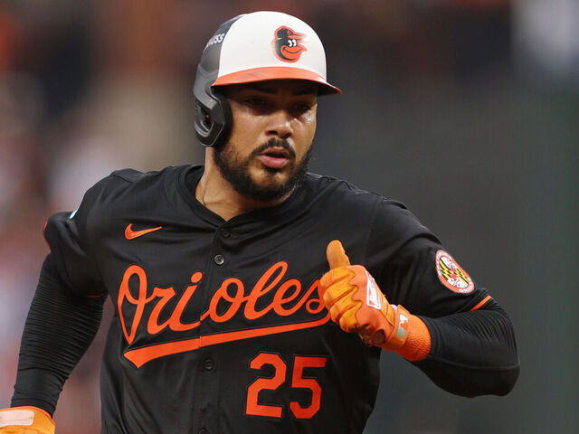BALTIMORE, MARYLAND - OCTOBER 02: Anthony Santander #25 of the Baltimore Orioles advances to third base on a fielder's choice against the Kansas City Royals hit by Ryan O'Hearn (not pictured) during the fourth inning of Game Two of the Wild Card Series at Oriole Park at Camden Yards on October 02, 2024 in Baltimore, Maryland.