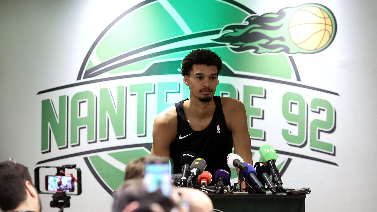 San Antonio Spurs' French forward-center #01 Victor Wembanyama (R) delivers remarks during a press conference on the sidelines of a training session at Palais des Sports Maurice Thorez in Nanterre on January 20, 2025. San Antonio Spurs will face the Indiana Pacers on January 23 and 25 at The Accor Arena in Paris, for two NBA games relocated to Paris.