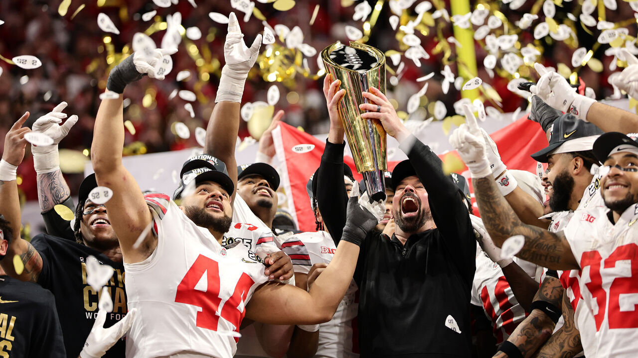 ATLANTA, GEORGIA - JANUARY 20: Head coach Ryan Day and the Ohio State Buckeyes hoist the trophy after beating the Notre Dame Fighting Irish 34-23 in the 2025 CFP National Championship at the Mercedes-Benz Stadium on January 20, 2025 in Atlanta, Georgia.