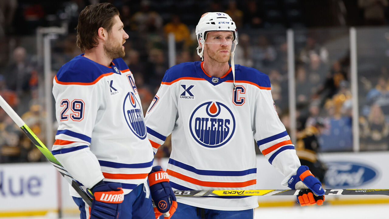 BOSTON, MASSACHUSETTS - JANUARY 7: Connor McDavid #97 and Leon Draisaitl #29 both of the Edmonton Oilers look on during warm-up before a game against the Boston Bruins at the TD Garden on January 7, 2025 in Boston, Massachusetts.