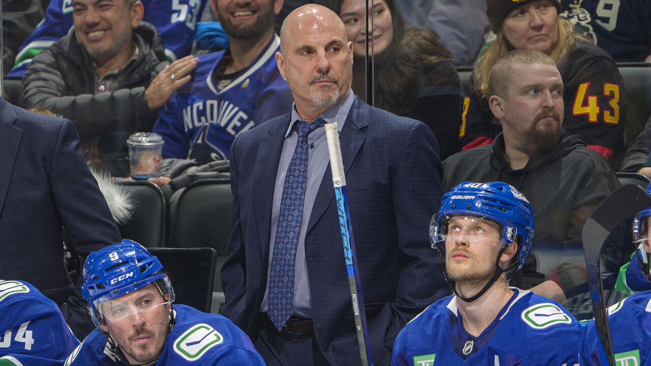VANCOUVER, CANADA - JANUARY 16: Head coach Rick Tocchet, J.T. Miller #9 and Elias Pettersson #40 of the Vancouver Canucks during the third period of their NHL game against the Los Angeles Kings at Rogers Arena on January 16, 2025 in Vancouver, British Columbia, Canada.